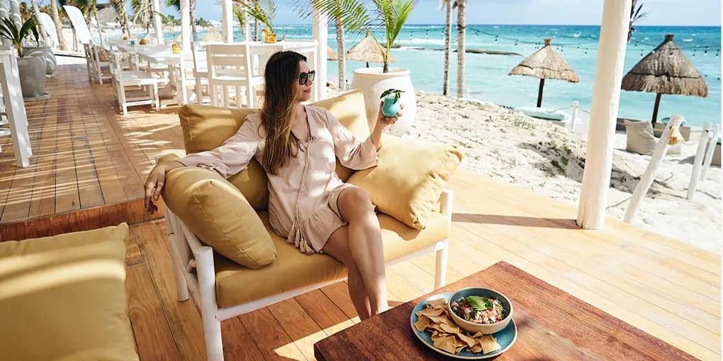 Lounge deck and palapa umbrellas at the development’s beach club