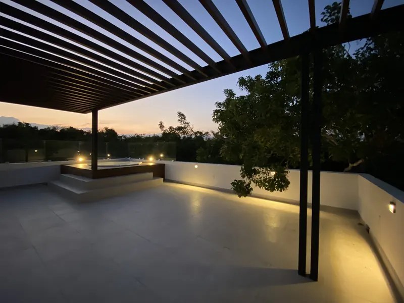 Tortuga villa rooftop pergola terrace at dusk